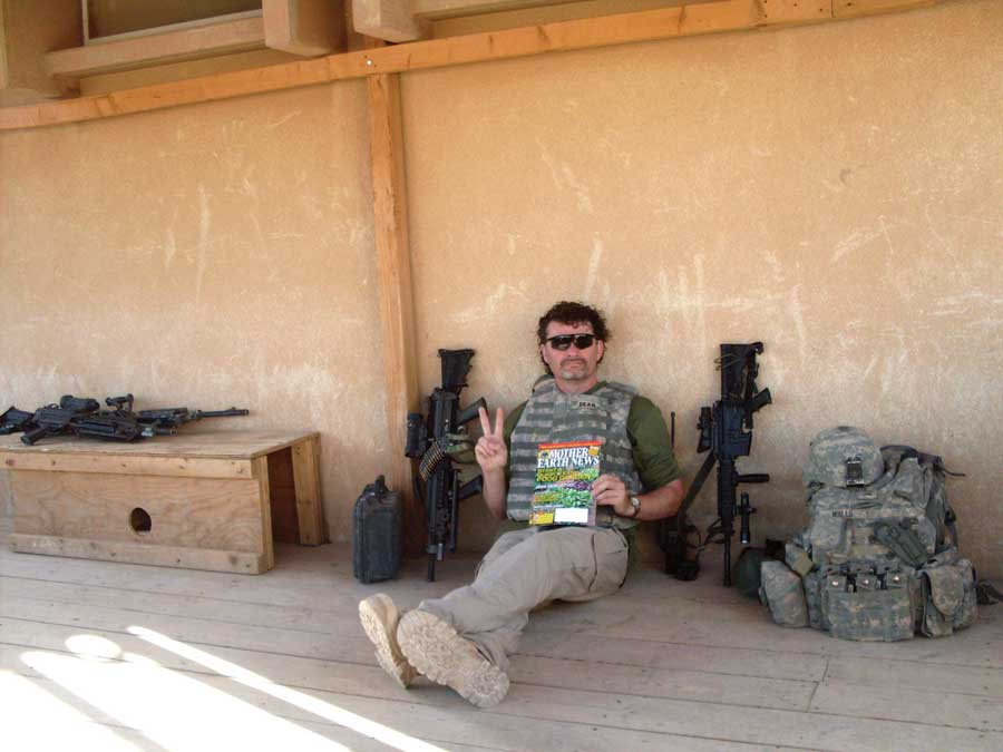 
Ethan Dean reads MOTHER EARTH NEWS during a break in his duties in Iraq.
